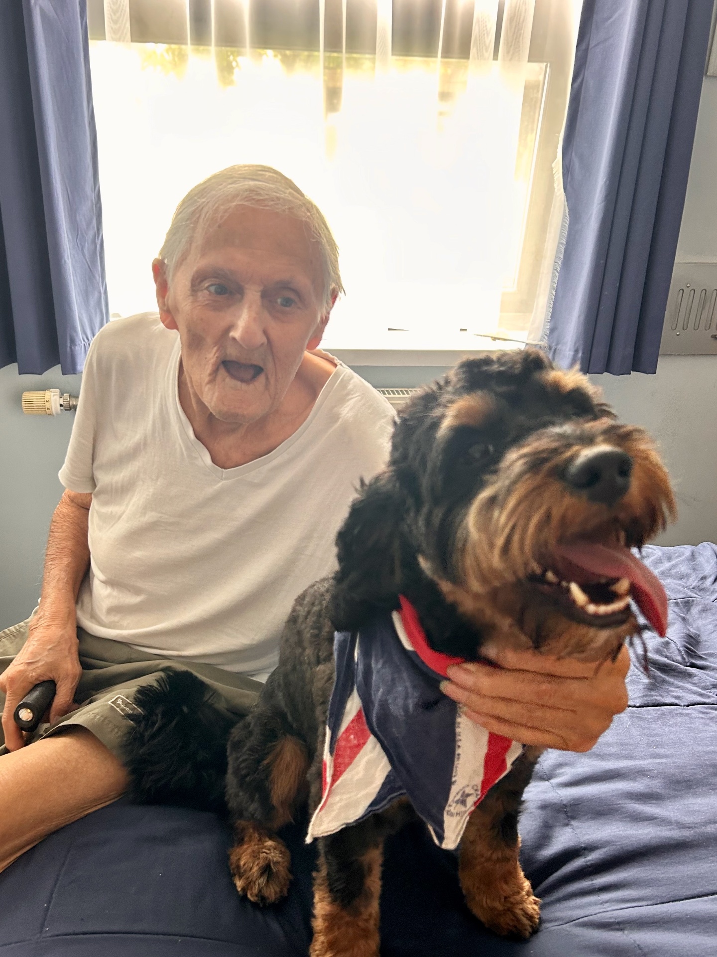 Client sharing a joyful moment with a beloved companion dog