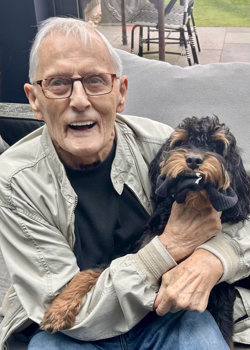 Elderly client enjoying quality time with their beloved pet